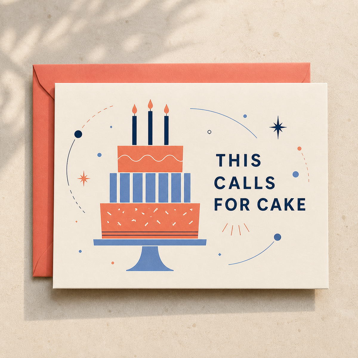 This Calls for Cake birthday card styled with a coral envelope